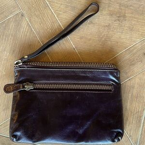 Dark Merlot wrist purse with storage pockets